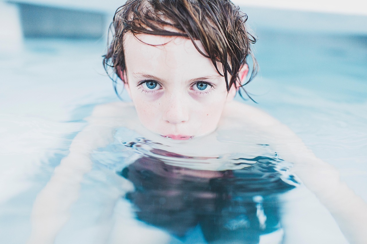 child, nature, swimming, boy, little boy, clear water, fun, kid, leisure, little, water, wet, swim, swimming pool, pool, blue eyes, youth, childhood, portrait, boy portrait