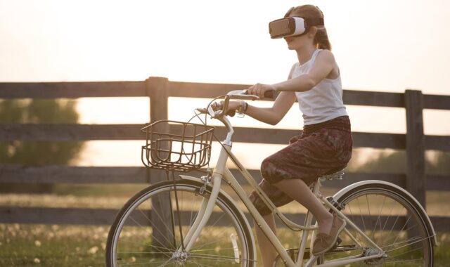augmented reality, bicycle, girl, bike, child, cyclist, metaverse, fence, fun, outdoors, person, virtual reality, virtual reality glasses, virtual reality goggles, virtual reality headset, vr headset